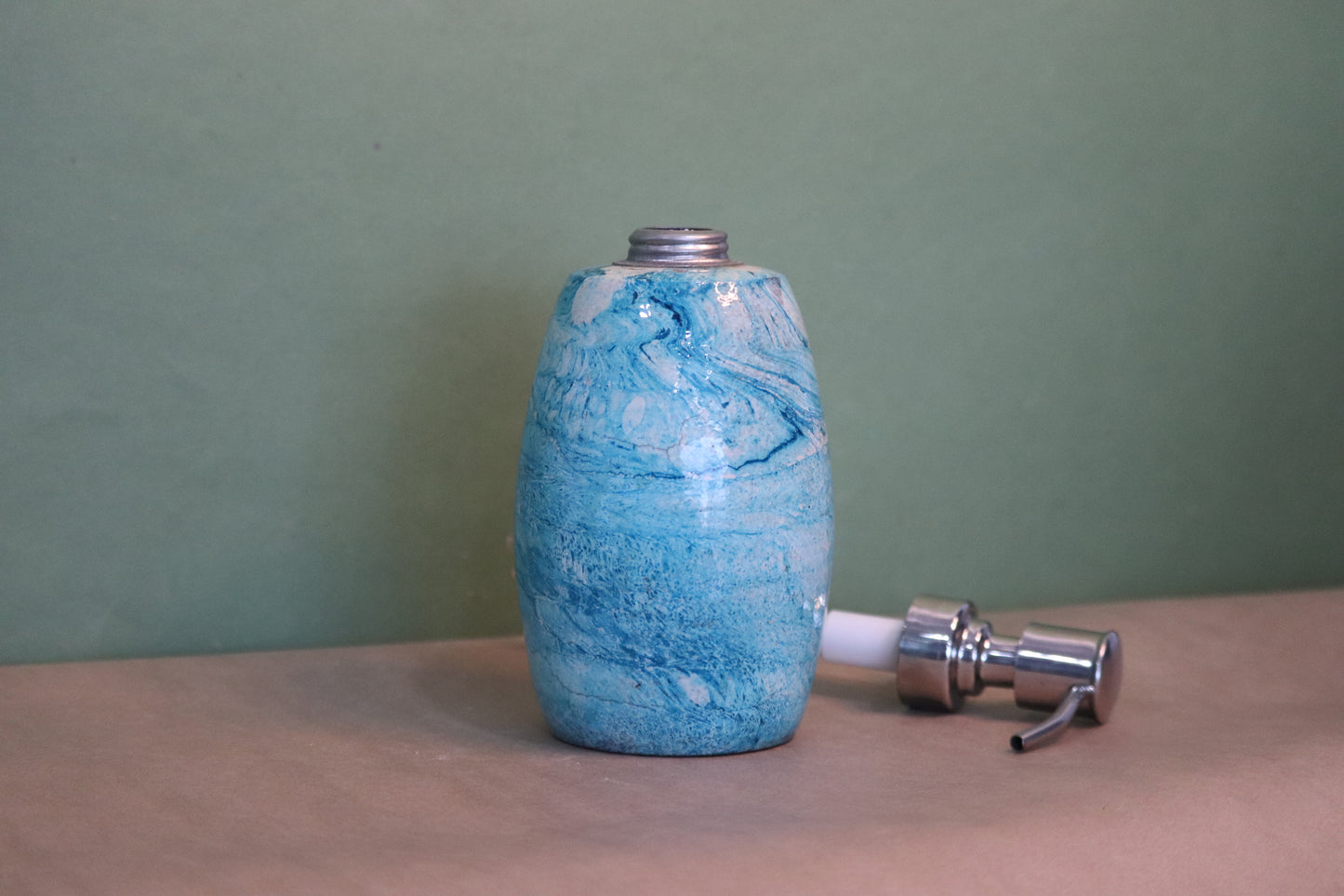 Blue terracotta marble paint dispenser